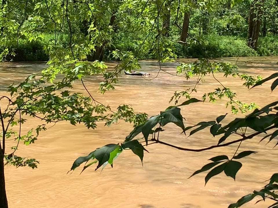Drunk man rescued after passing out with rum bottle in lap, floating 7 miles down flooded river