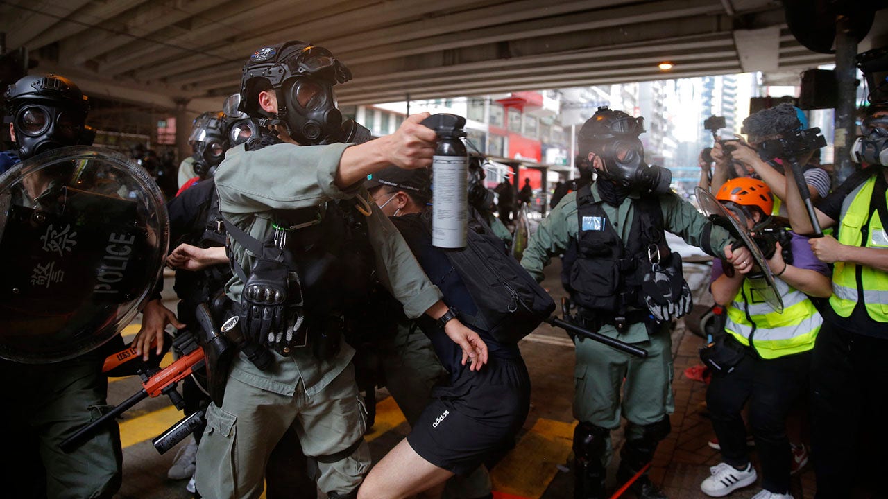 Hong Kong police fire tear gas, water canon as pro-democracy supporters protest new China law - Fox News