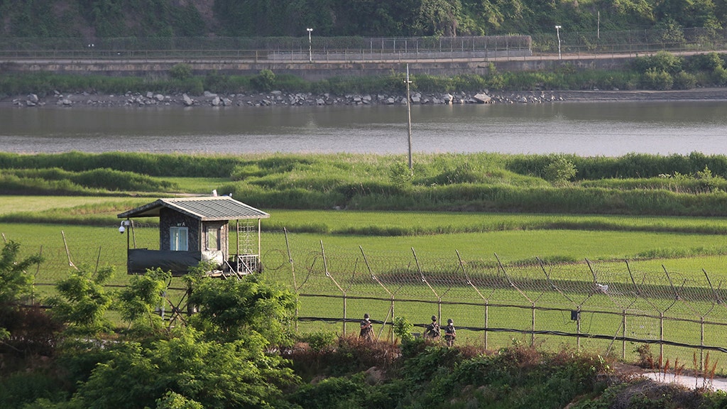 A North Korean defector with diving gear swims to South Korea