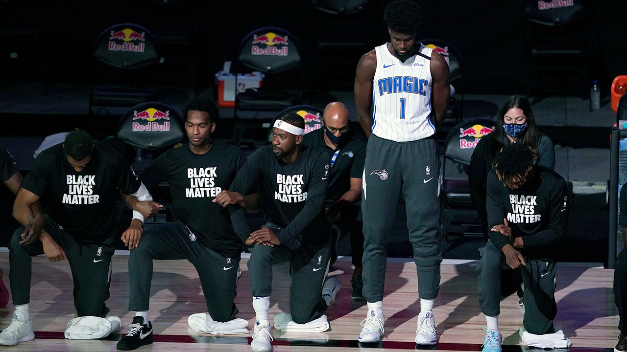 Magic’s Jonathan Isaac stands for national anthem as teammates, opponents kneel