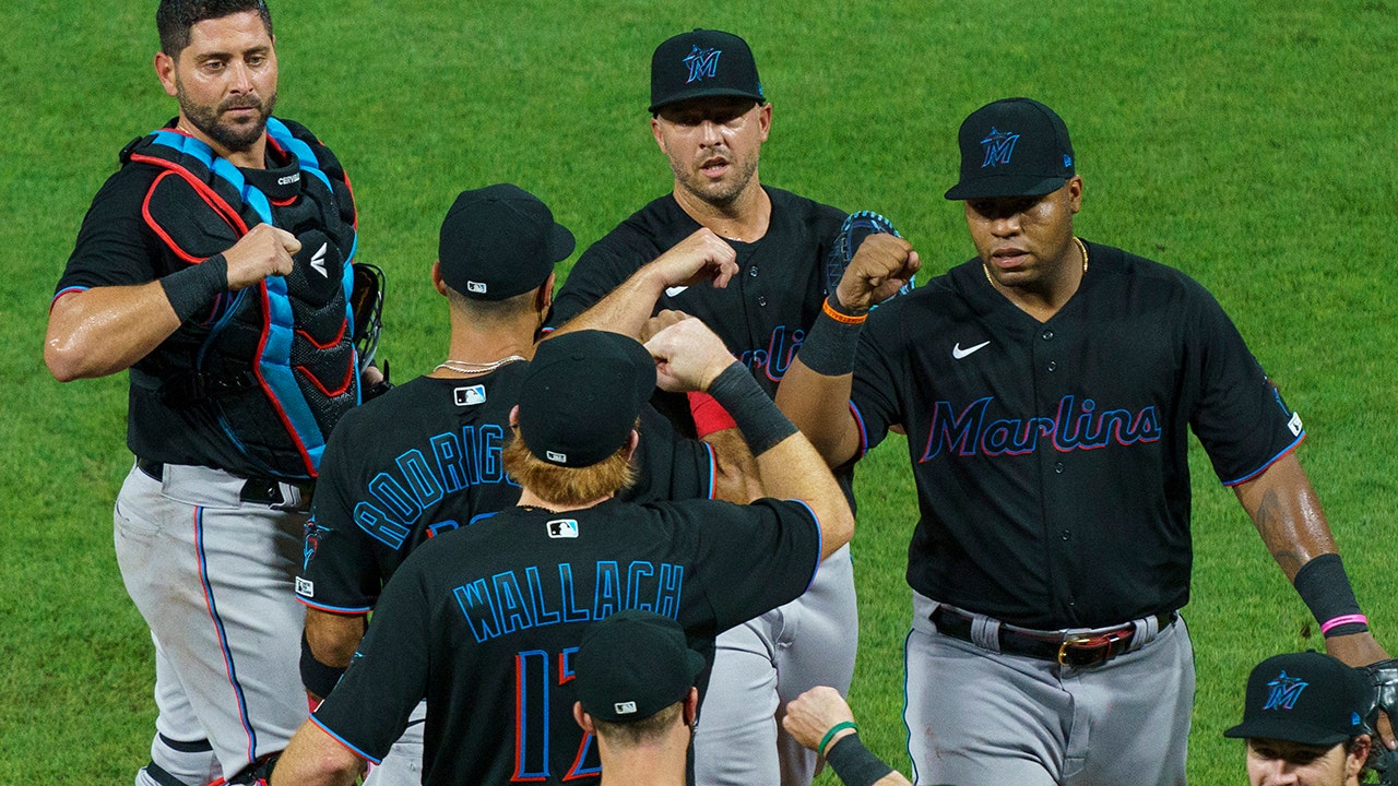 Marlins resume season with 18 new players and a win