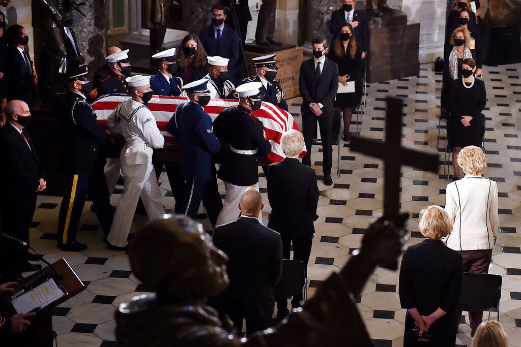 RBG’s personal trainer pays homage with a casket-side pushup