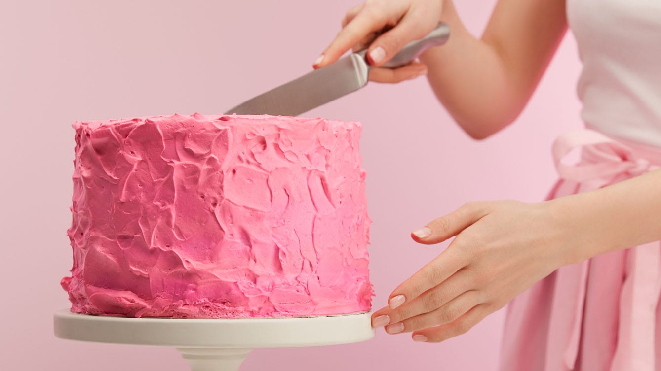 Baker makes lifelike 'selfie' cake, slices off piece of her 'face'
