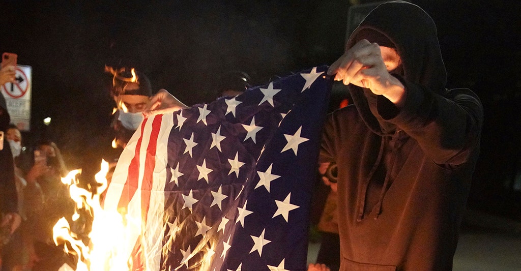 portland-unrest-prompts-arrests-objects-thrown-at-officers-flag-burned-reports
