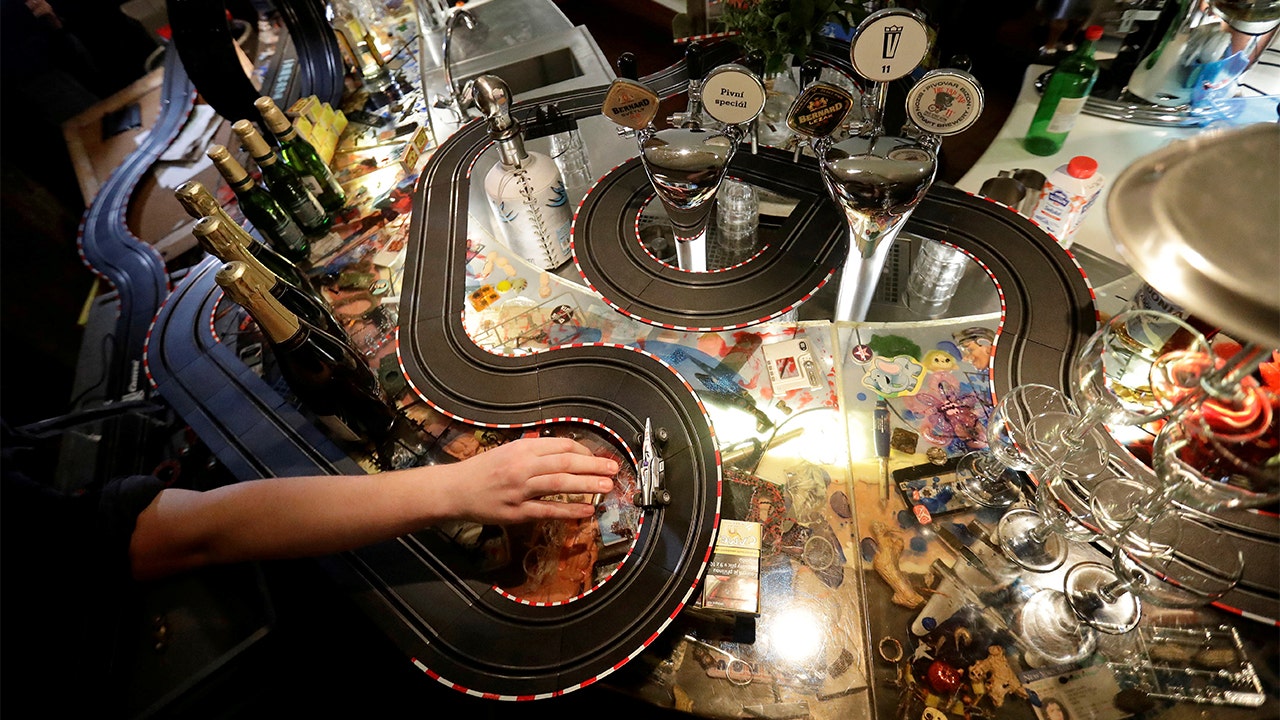 Prague cafe employees set up slot car races throughout bar emptied by COVID-19 - Fox News