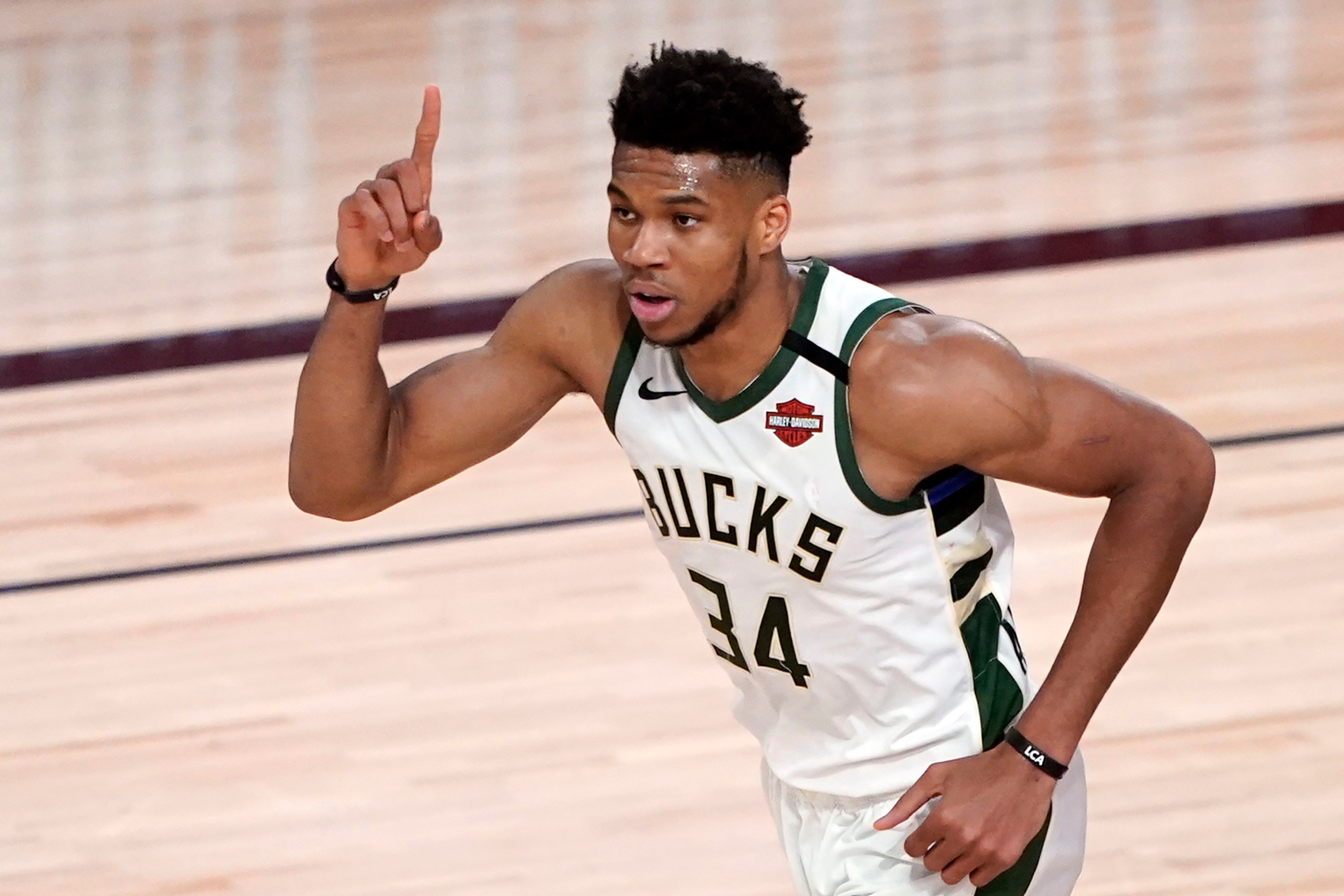 Bucks, Pistons players kneel after opening the tip