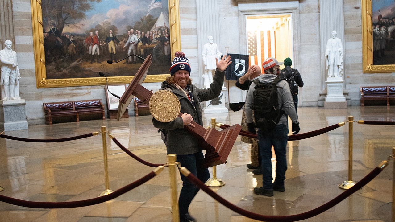 Pictures of the US Capitol rioter carrying Pelosi’s lectern leading to prison
