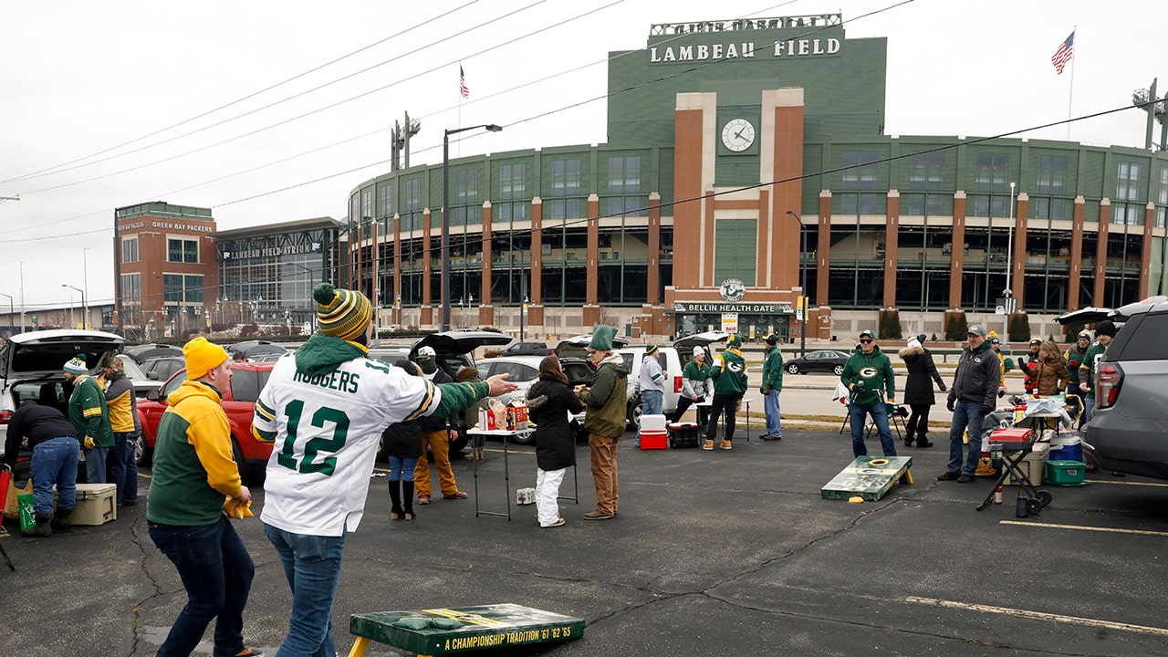Packers fans raise their eyebrows with the COVID flag at Lambeau Field