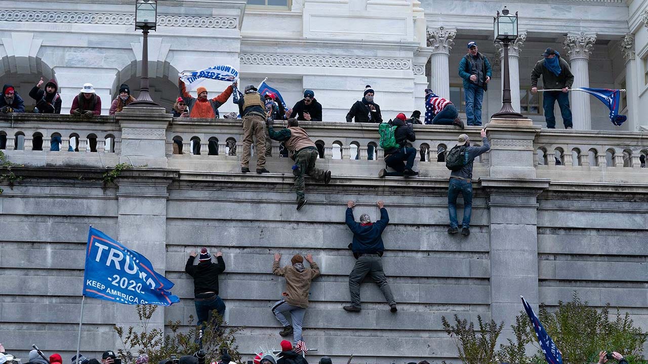 FBI releases new photos of Capitol riot suspects still 'at large,' appeals for public's help