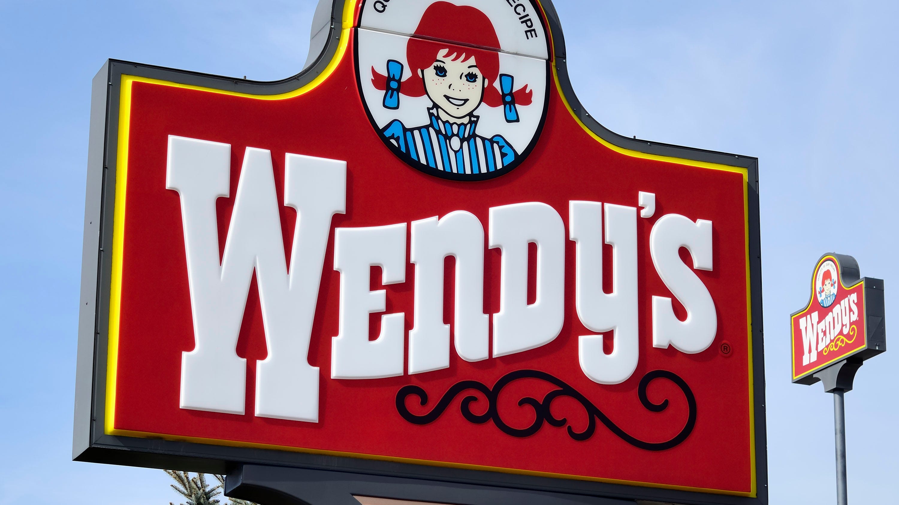 Car crashes onto Wendy's after accident launches it into the air