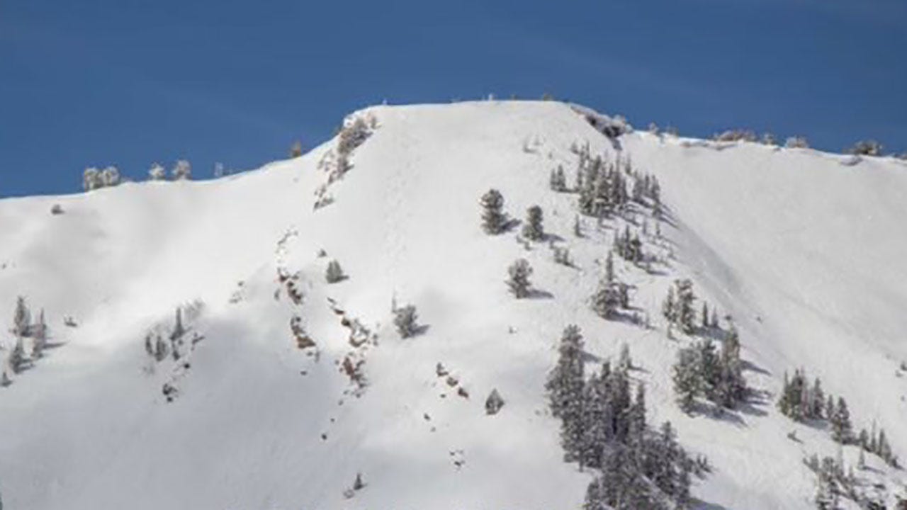 The skier in Utah was buried after causing a landslide in the countryside, officials say, while rescue efforts continue