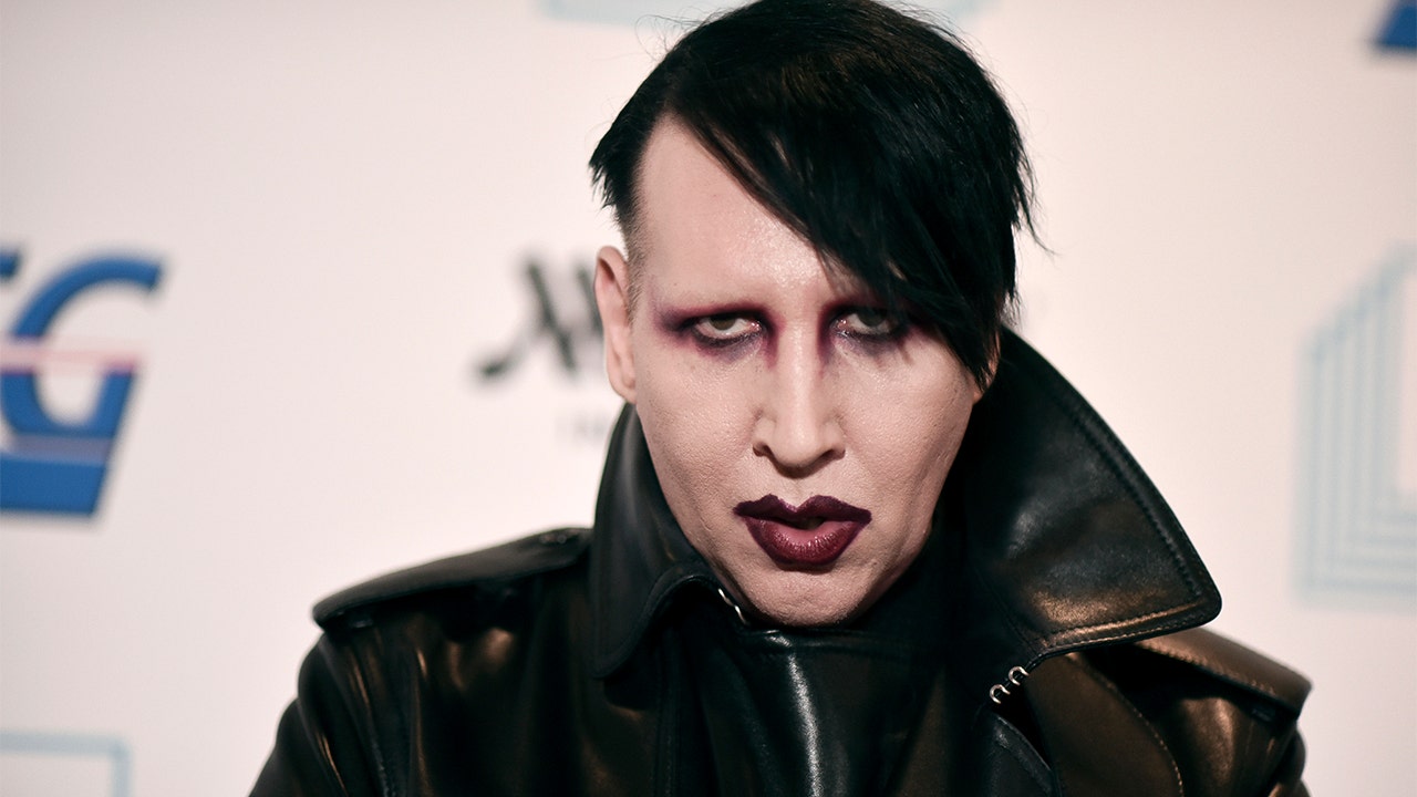 Marilyn Manson to turn himself in on arrest warrant over assault charges
