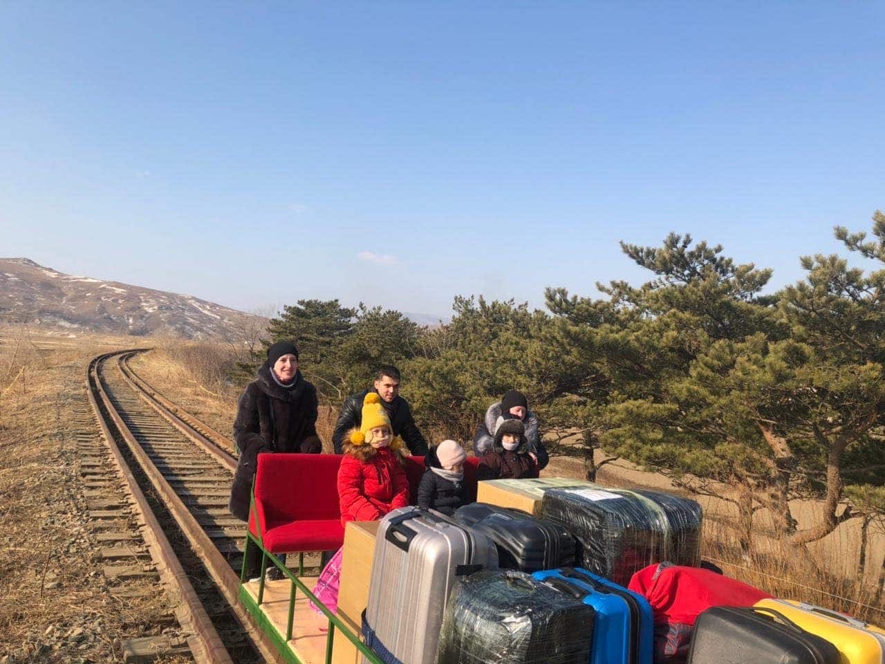Russian diplomats leave North Korea with hand-held trolley