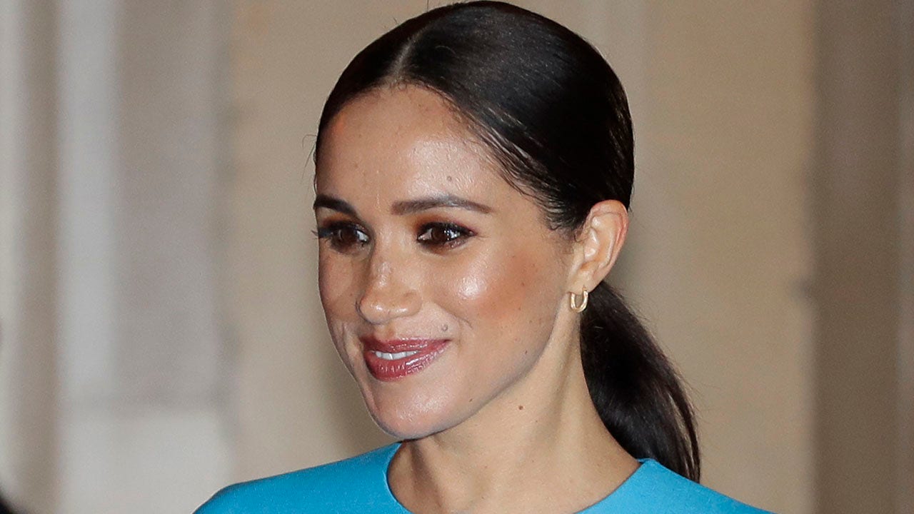 Meghan Markle’s absence at Prince Philip’s funeral ‘quietly pleased’ royal family members, e book promises