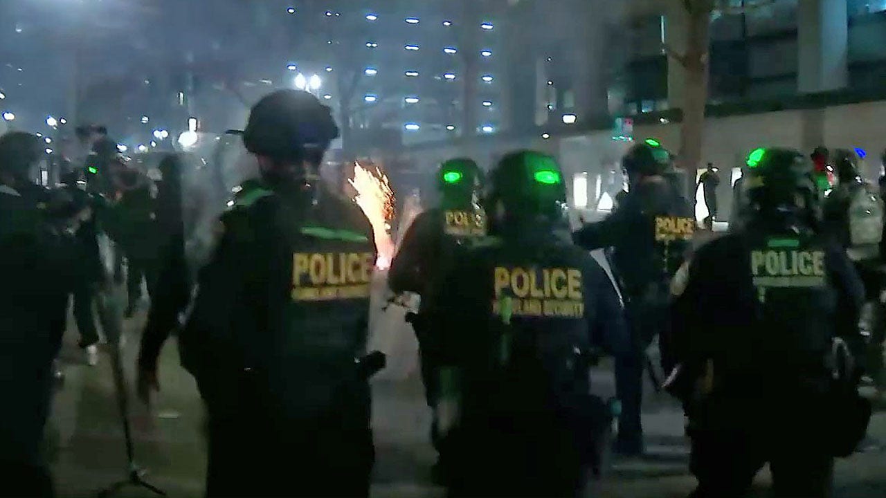 Portland police surrounds, detains protesters caught smashing windows