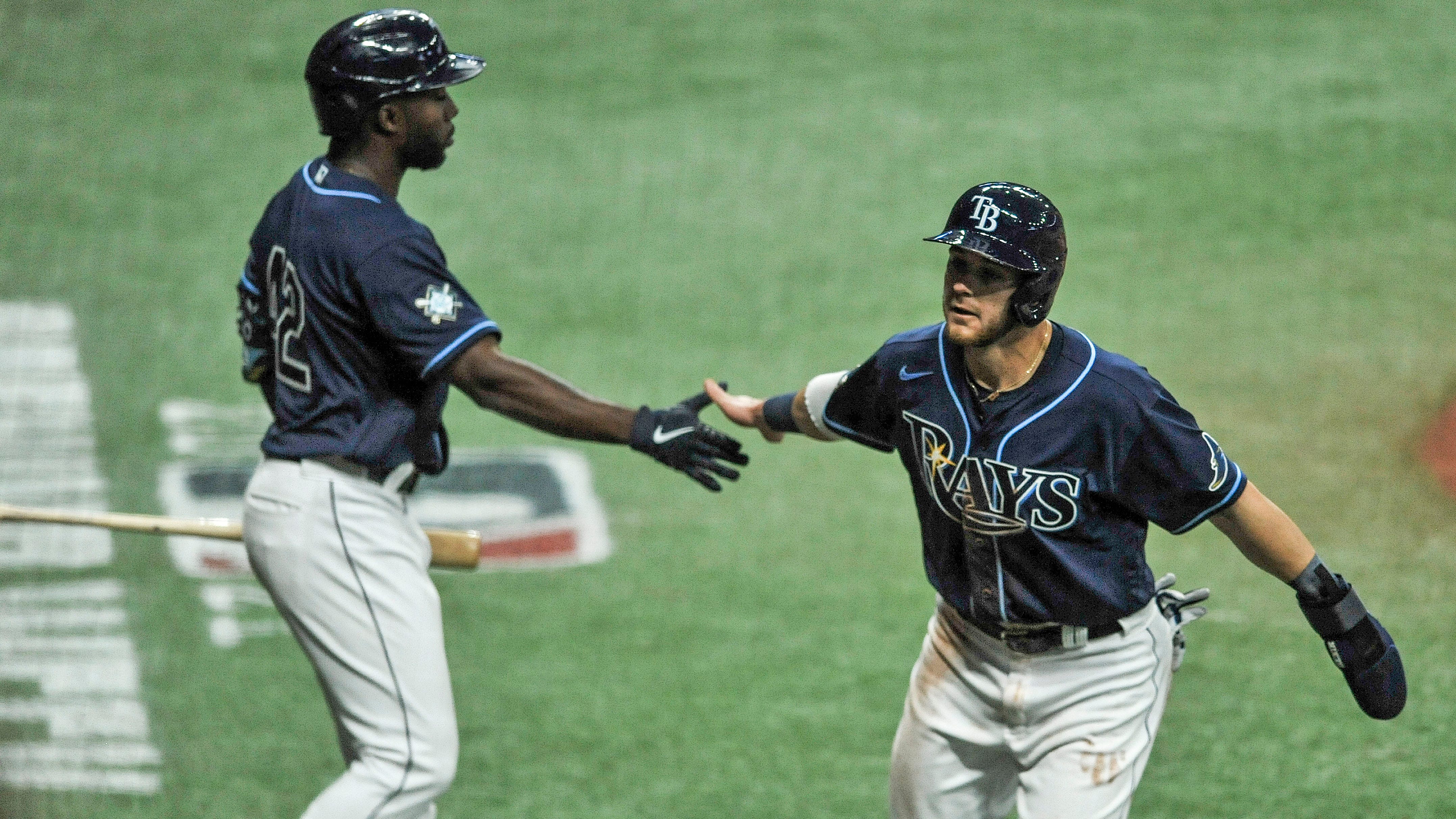 Texas Rangers outfielders Charlie Culberson, left, Leody Taveras