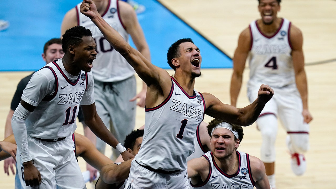 Former Gonzaga star Adam Morrison goes wild after the winner of the game by Jalen Suggs vs.  UCLA