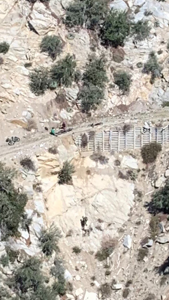 LA mountain biker dangles from side of cliff, is rescued by helicopter