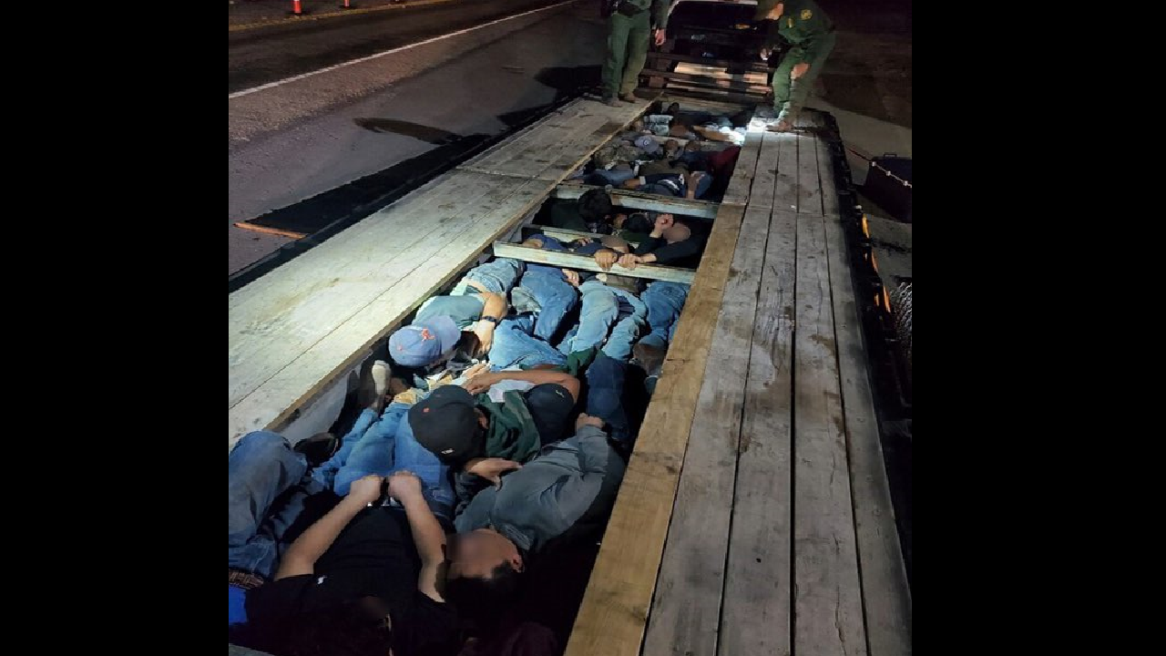 Border Patrol agents in Texas discover 18 adults, 2 kids hiding under a truck's trailer boards