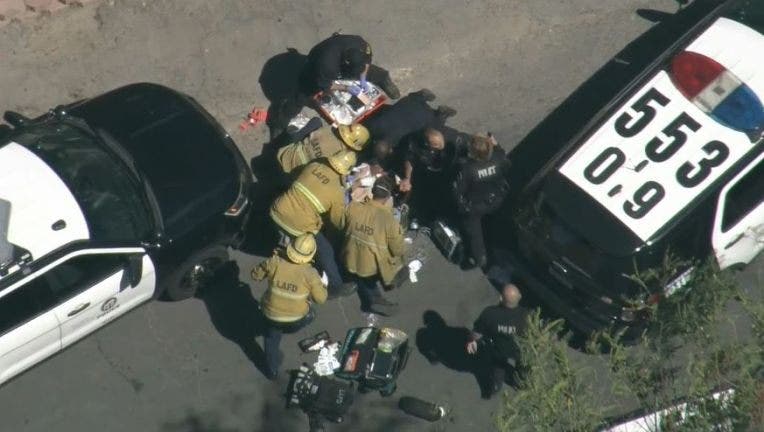 Los Angeles police officer shot in 'gun battle' with burglar, suspect also shot and in custody