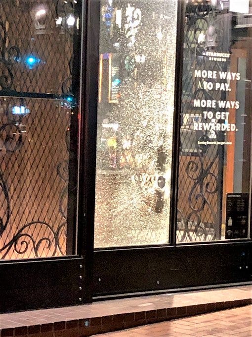 Portland police declare riot, post photos of damage to buildings