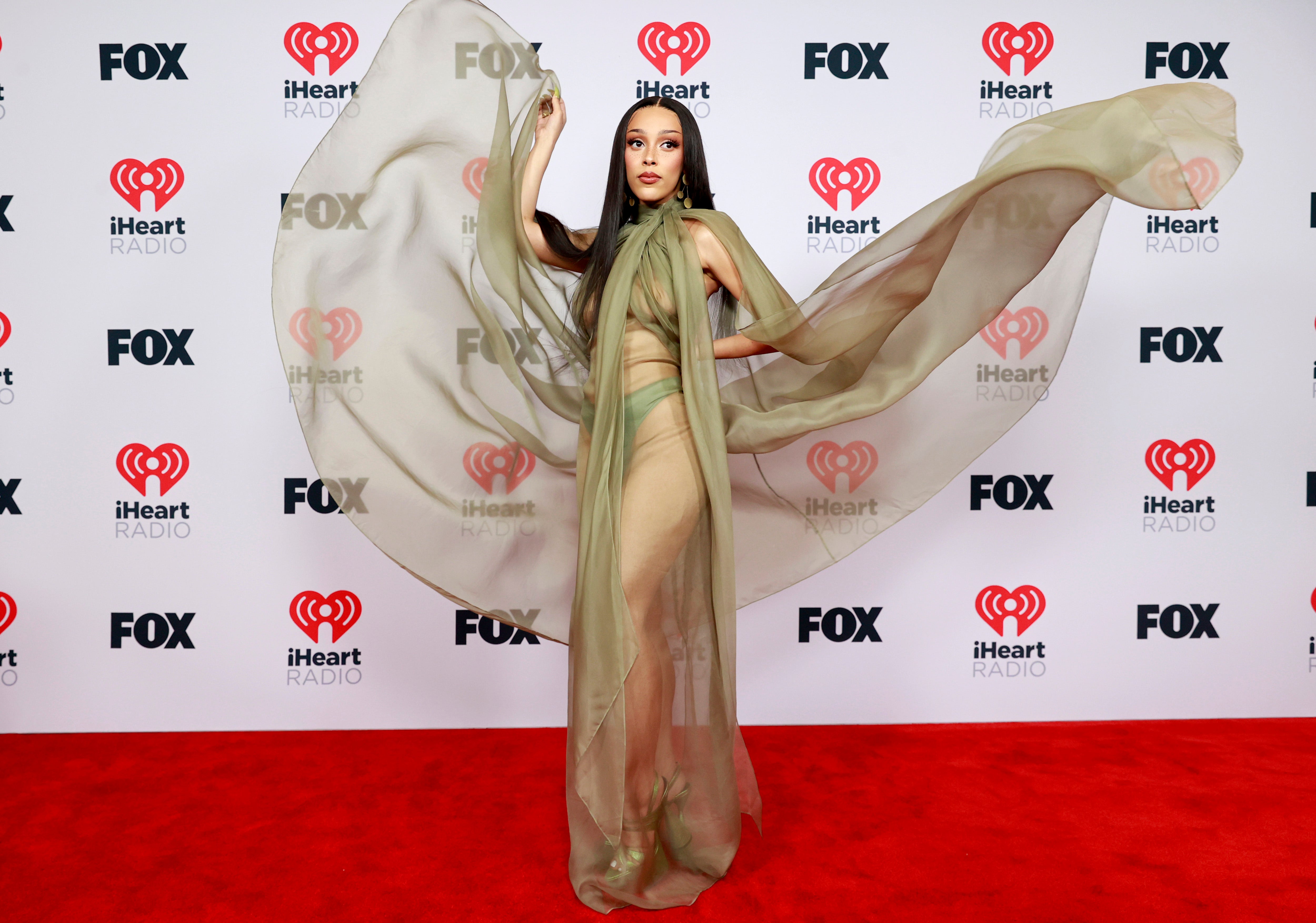 Doja Cat rocks see-through dress on 2021 iHeartRadio Music Awards red carpet