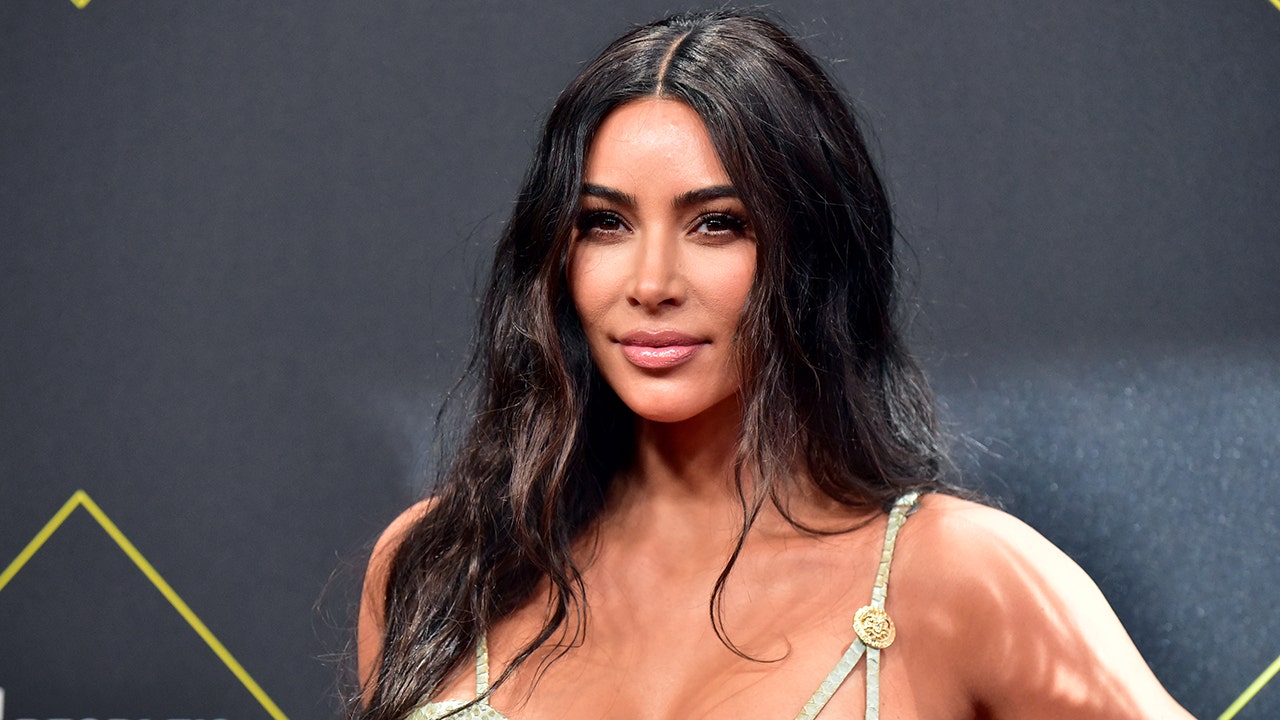 Kim Kardashian shows off figure, platinum blonde hair while working out in revealing swimsuit - Fox News