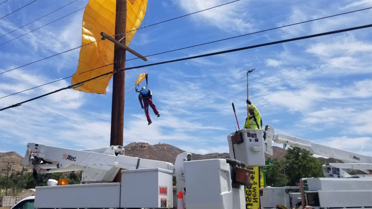 Parachuter gets caught in power lines, left dangling 30-feet in the air for over an hour