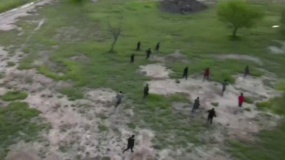 Fox News spots migrant group running across southern border into US