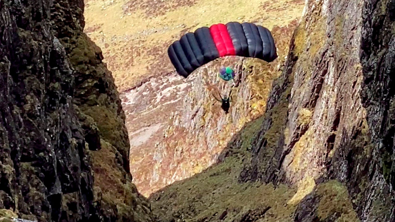 Daredevil parachutes from UK’s narrowest ridge in stomach-dropping video