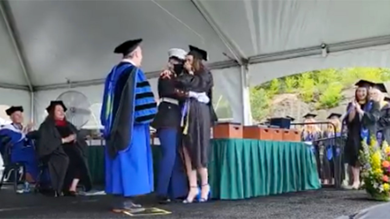 Marine surprises sister at college graduation after a year apart due to the pandemic