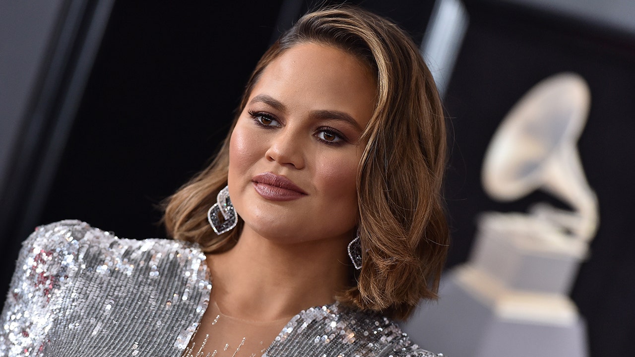 Chrissy Teigen reveals new ink honoring daughter's pre-school graduation in first post after apology