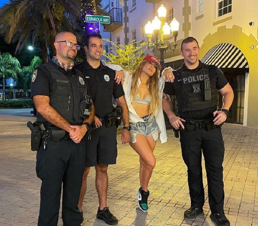 Jennifer Lopez poses for photo with Miami Beach police officers during video shoot