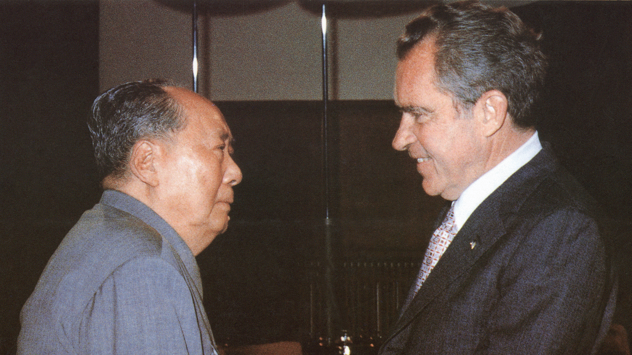 Chinese communist leader Chairman Mao Zedong (L) welcomes US President Richard Nixon, at his house in Beijing. President Nixon urged China to join the United States in a "long march together" on different roads to world peace