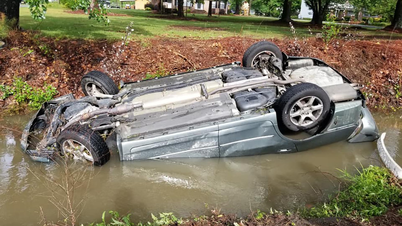 North Carolina police officers hailed as heroes after rescuing woman from overturned, submerged vehicle