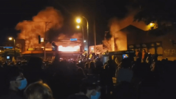 Protesters in Minneapolis, Minnesota, took over and burned the police department’s 3rd Precinct building on May 28, 2020, as the city’s unrest continued for a fourth day following the death of George Floyd.