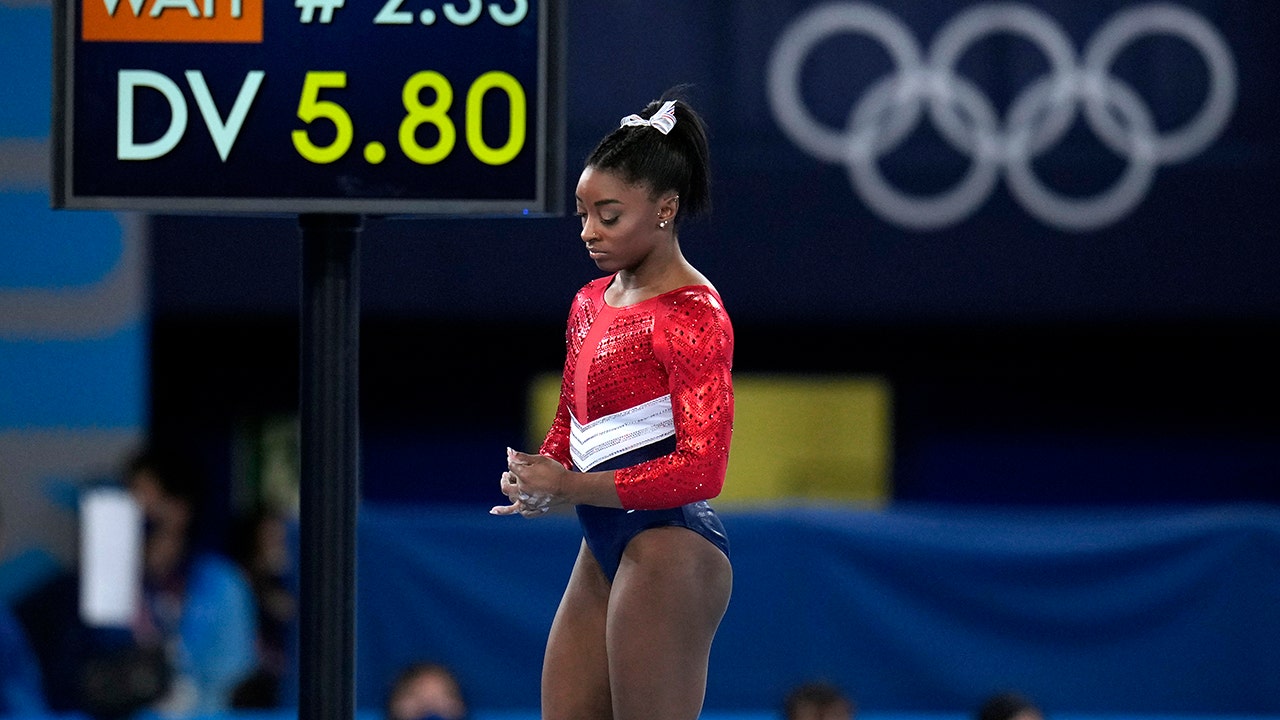 Simone Biles withdraws from vault and bars, may still compete on floor