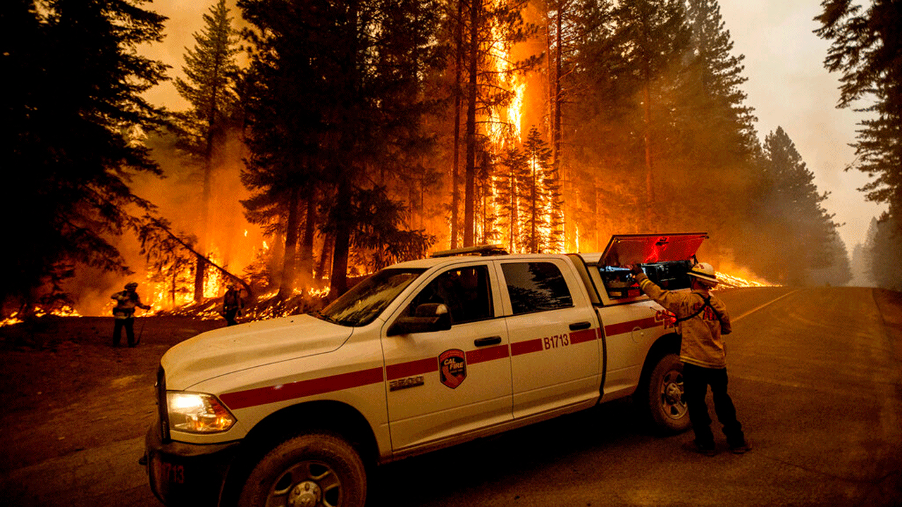 Firefighters monitor a backfire they lit to stop the Dixie Fire from spreading near Prattville in Plumas County, Calif., on Friday, July 23, 2021. AP Photo/Noah Berger