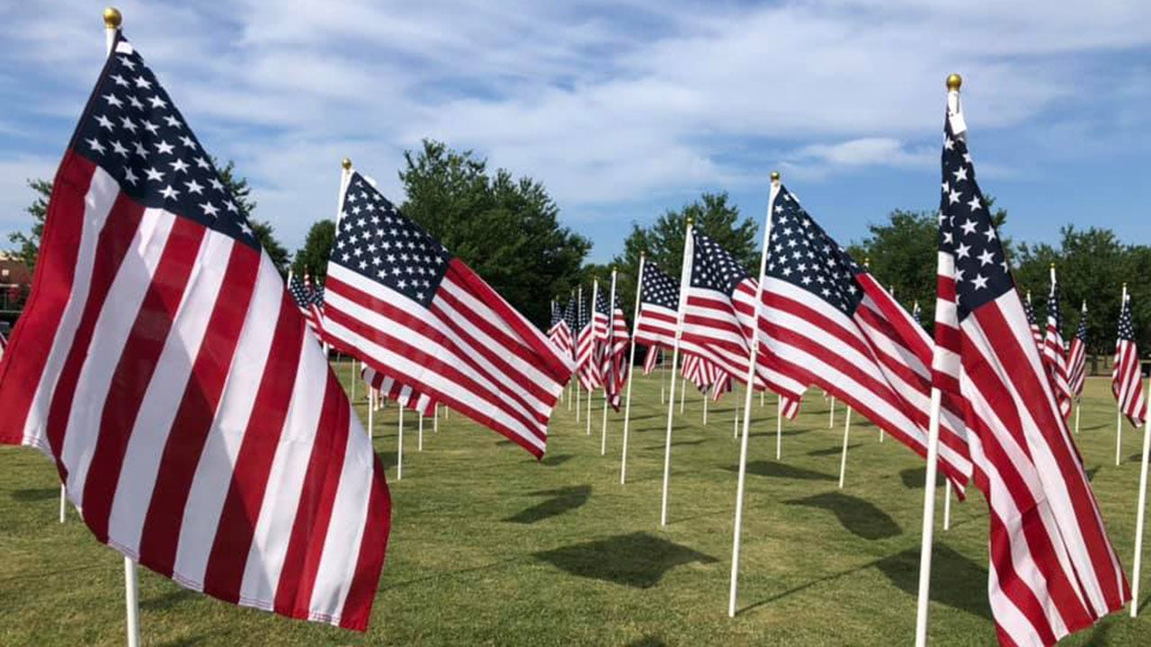 North Carolina Scout troops camp out, watch over American flag display