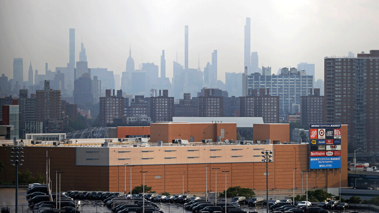 Manhattan is seen from Yankee Stadium through a haze of smoke before a baseball game between the Philadelphia Phillies and the New York Yankees, Wednesday, July 21, 2021, in New York. Wildfires in the American West, including one burning in Oregon that's currently the largest in the U.S., are creating hazy skies as far away as New York as the massive infernos spew smoke and ash into the air in columns up to six miles high.