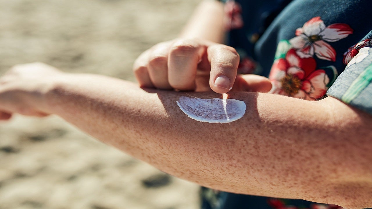 Man applying sunscreen