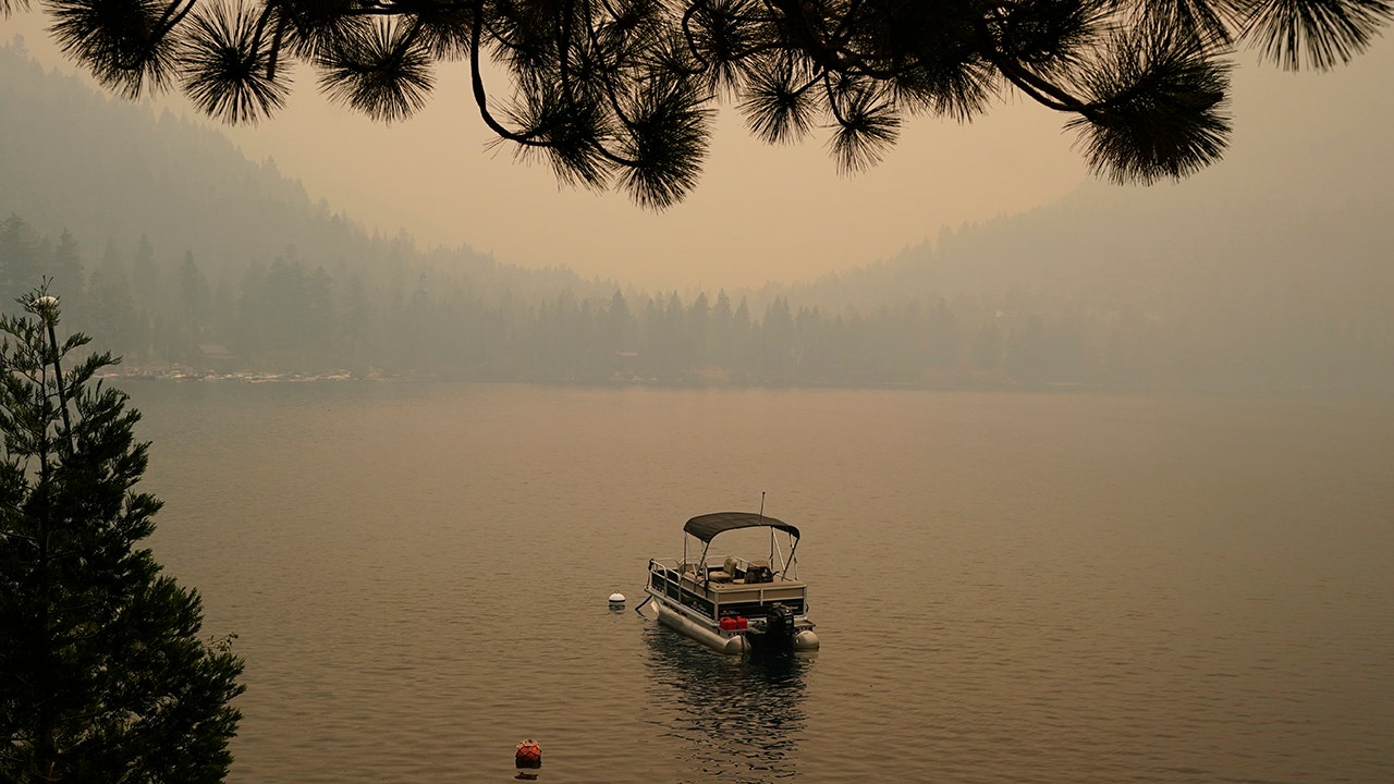 California fire advances toward Lake Tahoe after destroying hundreds of homes