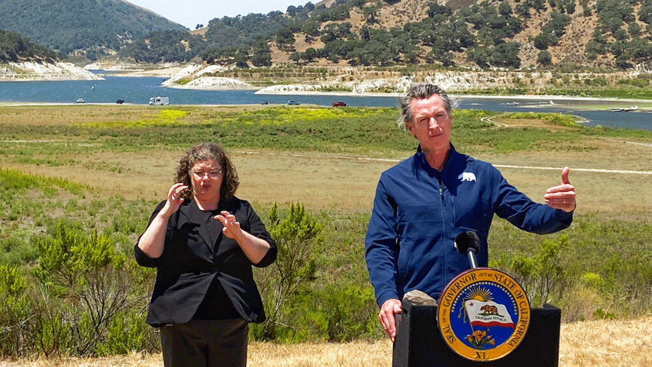 California Governor Gavin Newsom stands at the edge of depleted Lopez Lake near Arroyo Grande, California.  (David Middlecamp/The Tribune (of San Luis Obispo) via AP, File)