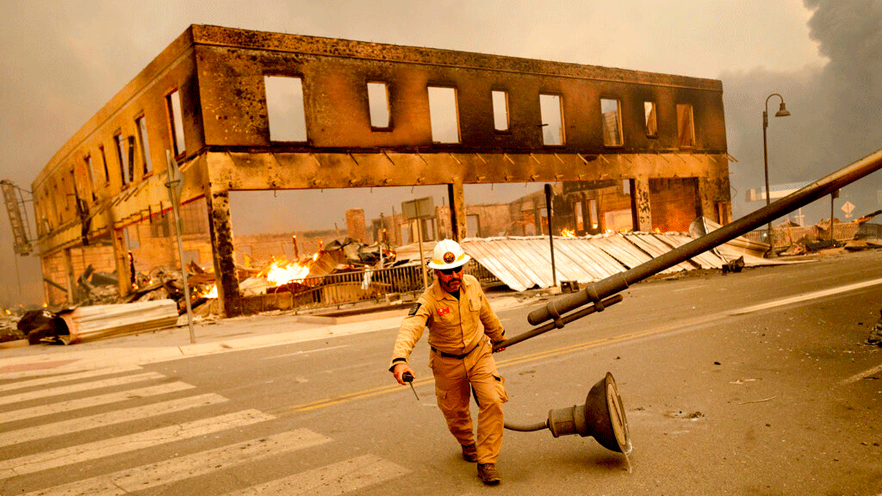 Chief Operating Officer Jay Walter moved a light post blocking Highway 89 when the Dixie Fire tore through the Greenville community in Plumas County, California, Wednesday, August 4, 2021. The fire ravaged several historic buildings and dozens of homes in downtown Greenville .  . 