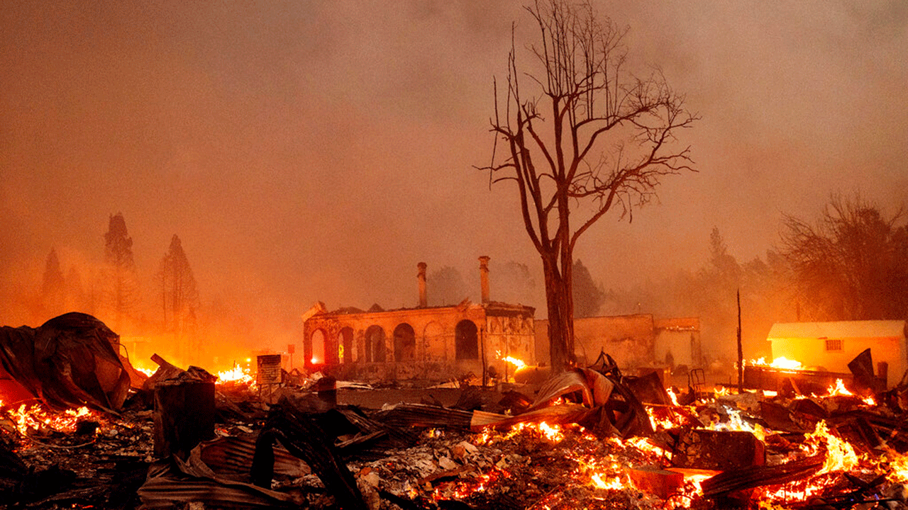 Buildings burn as the Dixie fire rips through the Greenville community of Plumas County, California on Wednesday, August 4, 2021.  The fire destroyed several historic buildings and dozens of homes in central Greenville.
