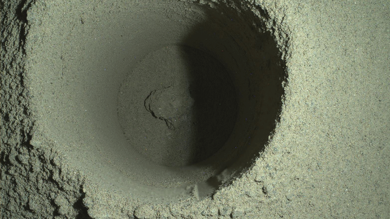 This composite image of the first borehole drilled by NASA's Perseverance rover on Mars was generated using multiple images taken by the rover's WATSON (Wide Angle Topographic Sensor for Operations and eNgineering) imager. The borehole is 1.06 inches (2.7 centimeters) in diameter. A subsystem of the SHERLOC (Scanning Habitable Environments with Raman &amp; Luminescence for Organics &amp; Chemicals) instrument, WATSON can document the structure and texture within a drilled target, and its data can be used to derive depth measurements. The image was taken on the mission's 165th Martian day, or sol, at night in order to reduce self-shadowing within the borehole that can occur during daylight imaging. Some of WATSON's white LEDs illuminated the borehole. NASA's Jet Propulsion Laboratory built and manages operations of Perseverance and Ingenuity for the agency. Caltech in Pasadena, California, manages JPL for NASA. WATSON was built by Malin Space Science Systems (MSSS) in San Diego and is operated jointly by MSSS and JPL.