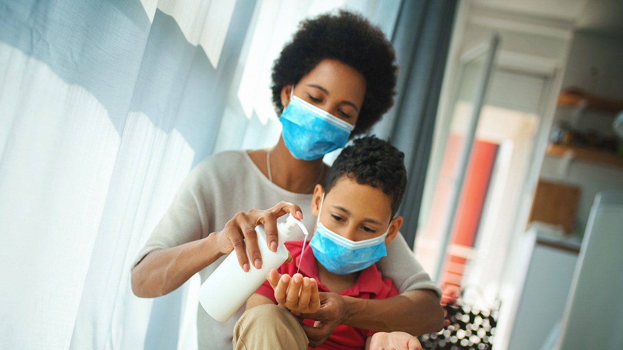 NIH director backs away from suggestion that parents wear masks at home to protect kids