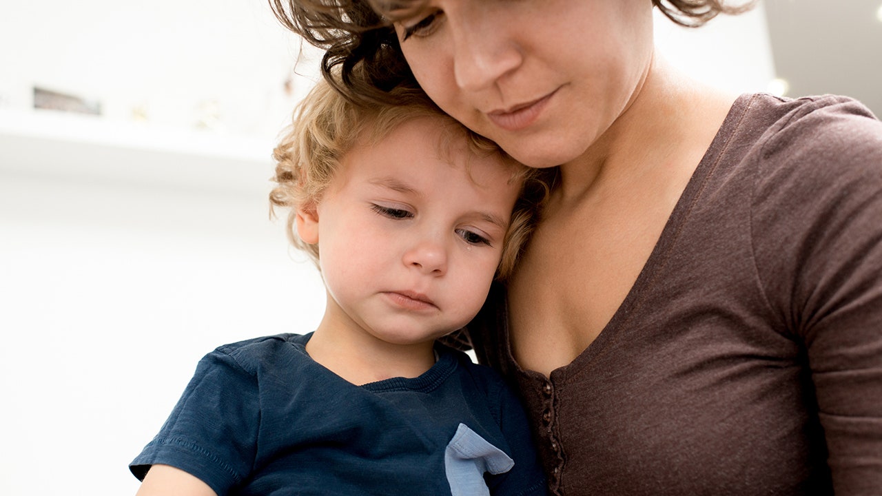 child crying with mom