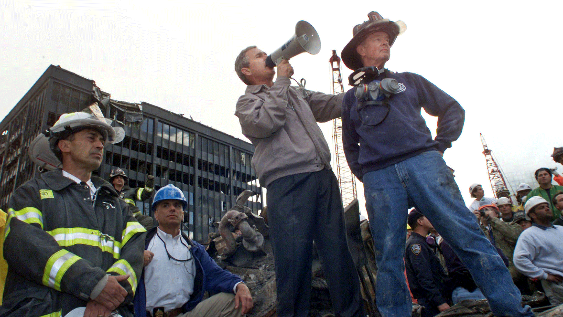 George W. Bush is shown with retired firefighter Bob Beckwith (R) at the scene of the World Trade Center disaster on September 14, 2001