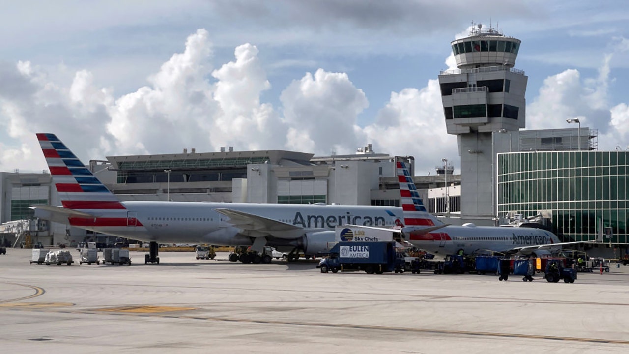 American Airlines passenger detained after allegedly opening emergency exit, walking on wing
